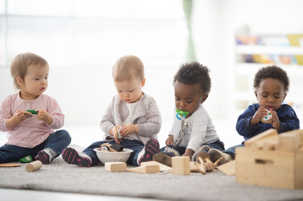 Diverse toddlers play at child care
