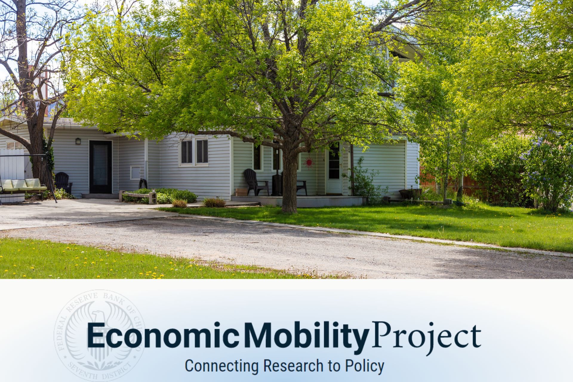 Economic Mobility Project - A single-family home on a tree-lined street in daylight
