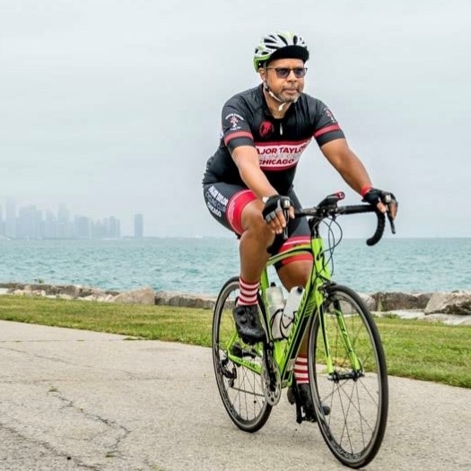 Gar Kelley cruising on his bike along the Chicago Lakefront Trail 