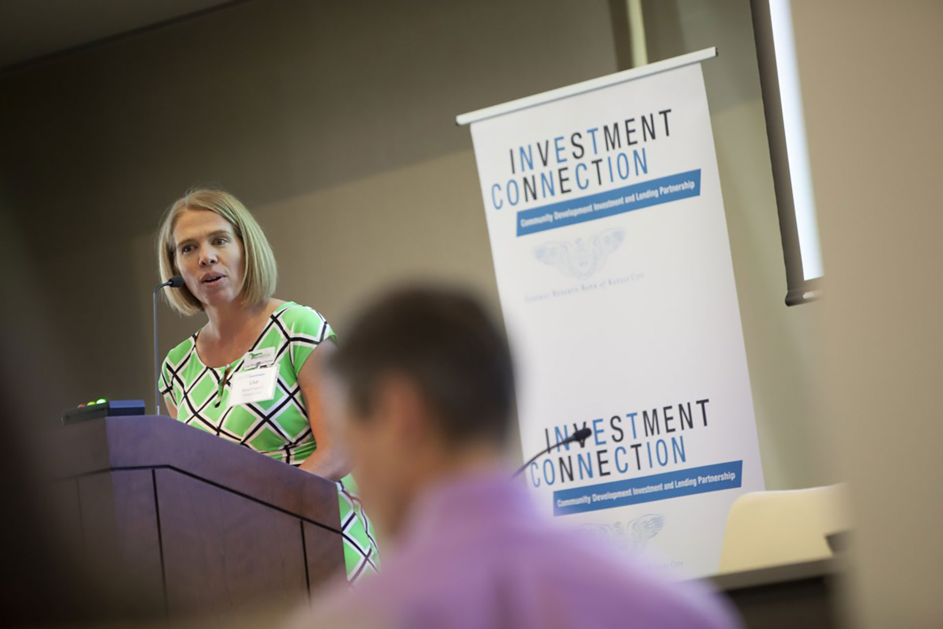 Person standing at a podium at a recent Investment Connection event hosted by the Kansas City Fed