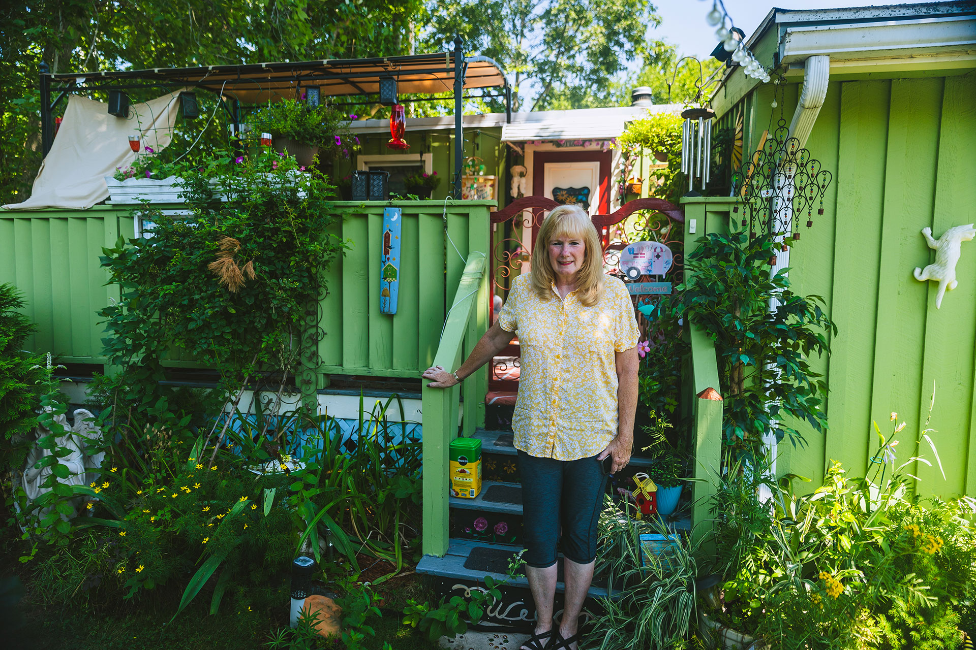 Pam Rothgaber stands outside her home, which is part of the Friendship Drive Cooperative in Salem, New Hampshire Photo courtesy of Steve Osemwenkhae, Federal Reserve Bank of Boston