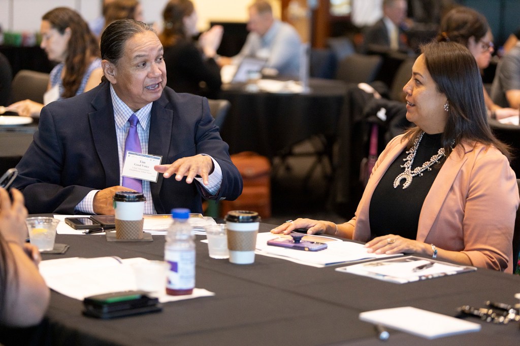 Participants exchange ideas and information between sessions.