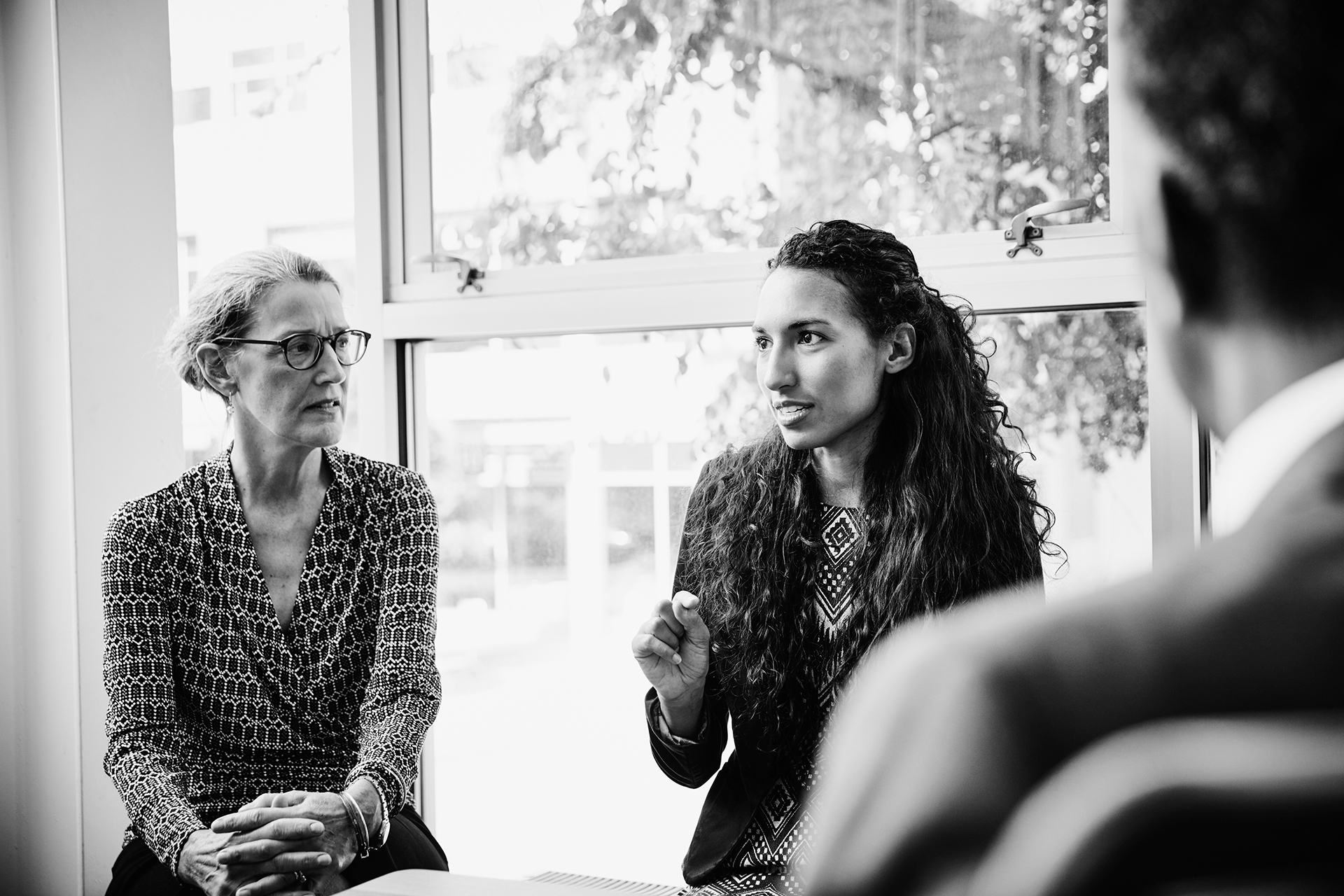 A person leads a focus group discussion.