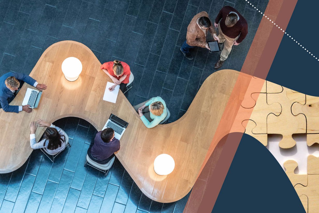 An aerial shot of people meeting together in a coworking space.