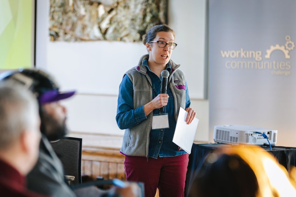Colleen Dawicki speaks to a crowd at a Working Communities challenge event in East Hartford, CT.