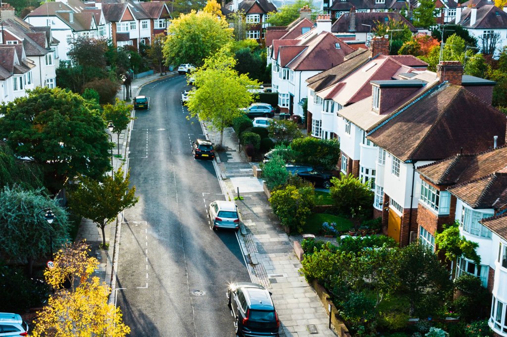 Aerial view, taken by drone, depicting town homes on a residential street