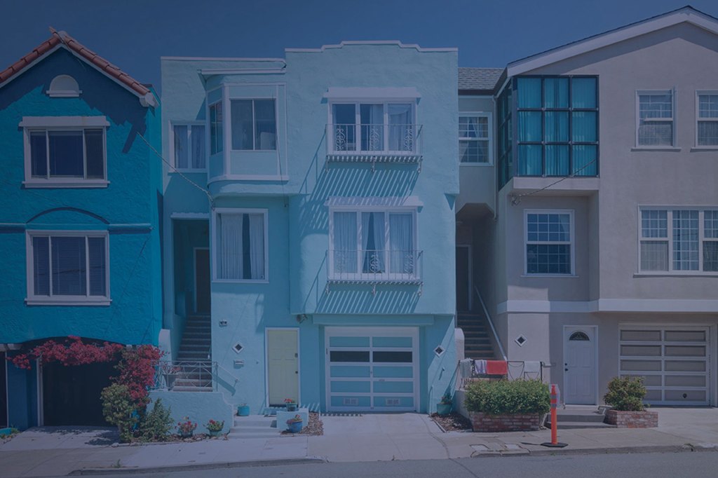 Old scenic victorian wooden houses at a steep hill in San Francisco