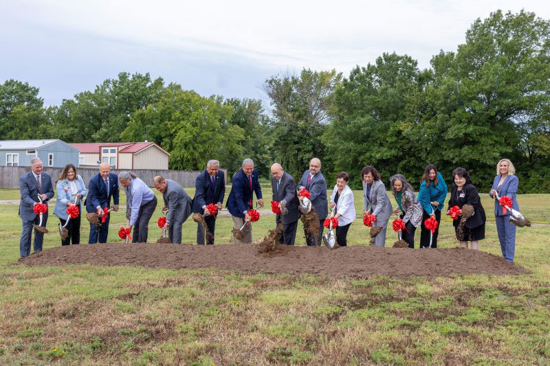 A group of people breaking ground for a new housing project