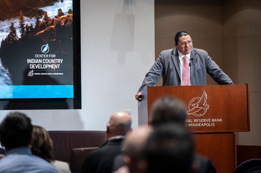 Phil Gover standing at a podium during the CICD Data Summit event