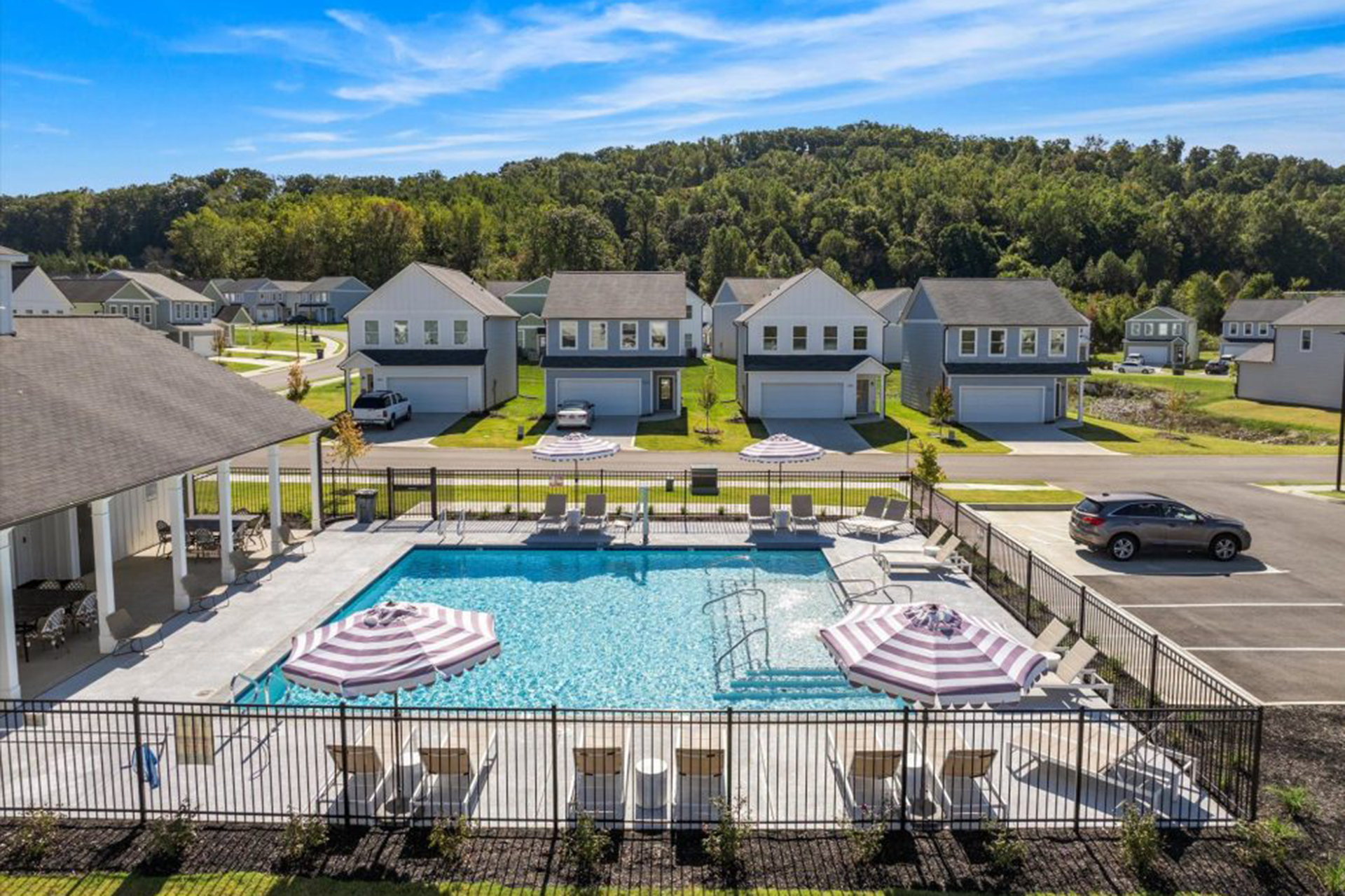 A new rental community with single family homes and a community pool. 